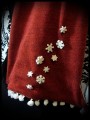 Burnt orange scarf white lining snowflakes buttons